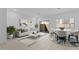 Bright and airy living room, complete with tile floors, modern furniture, and sliding glass door at 7434 S 75Th Dr, Laveen, AZ 85339