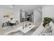 Open floorplan with modern furnishings, stainless steel appliances, and light gray cabinetry at 7434 S 75Th Dr, Laveen, AZ 85339