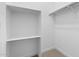 A simple yet functional walk-in closet offering ample storage space at 7434 S 75Th Dr, Laveen, AZ 85339