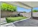 Covered patio with a tiled floor that overlooks a putting green in the backyard at 751 W Flintlock Way, Chandler, AZ 85286