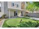 This backyard has a covered patio and a putting green for a fun outdoor space at 751 W Flintlock Way, Chandler, AZ 85286