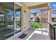 Balcony view with sliding glass door and iron railing overlooking the neighborhood at 751 W Flintlock Way, Chandler, AZ 85286
