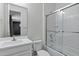 Bright bathroom featuring a shower-over-tub, white vanity, and a large mirror for a clean, modern look at 751 W Flintlock Way, Chandler, AZ 85286