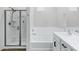 Well-lit bathroom offers a glass-enclosed shower, soaking tub, and modern fixtures for a spa-like experience at 751 W Flintlock Way, Chandler, AZ 85286