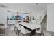 Open concept with dining area featuring modern lighting, staircase, and kitchen at 751 W Flintlock Way, Chandler, AZ 85286