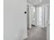 Upstairs hallway with carpet leading to a bathroom and bedroom at 751 W Flintlock Way, Chandler, AZ 85286