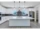Spacious kitchen featuring a large central island, modern appliances, and ample cabinet space at 751 W Flintlock Way, Chandler, AZ 85286