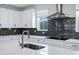 Modern kitchen design showcases an island, stylish backsplash, and updated appliances at 751 W Flintlock Way, Chandler, AZ 85286