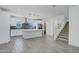 Modern kitchen with white cabinets, stainless steel appliances, and convenient staircase at 751 W Flintlock Way, Chandler, AZ 85286