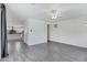 The living room offers an open-concept design with tile floors and views of the kitchen in the background at 751 W Flintlock Way, Chandler, AZ 85286