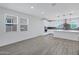 Open-concept living area with tile flooring, recessed lighting, and kitchen access at 751 W Flintlock Way, Chandler, AZ 85286