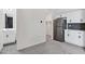 Open living space featuring a kitchenette, built-in cabinets, and an adjacent bathroom at 751 W Flintlock Way, Chandler, AZ 85286