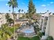Aerial view of the community showing a hot tub, lounge chairs, and landscaped green spaces at 7625 E Camelback Rd # 310B, Scottsdale, AZ 85251