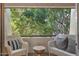Relaxing balcony offers comfortable seating and a view of lush trees and foliage at 7625 E Camelback Rd # 310B, Scottsdale, AZ 85251