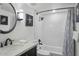 Bright bathroom features a shower over tub with subway tile, a modern vanity, and stylish decorations at 7625 E Camelback Rd # 310B, Scottsdale, AZ 85251