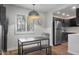 Bright dining area offers natural light and views of the modern kitchen at 7625 E Camelback Rd # 310B, Scottsdale, AZ 85251