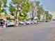 Multiple electric vehicles charging in a row of Tesla Supercharger charging stations at 7625 E Camelback Rd # 310B, Scottsdale, AZ 85251