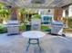 Community grilling area features two stainless steel grills, a table, and easy access to water at 7625 E Camelback Rd # 310B, Scottsdale, AZ 85251