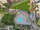 Aerial view of a community hot tub with lounge seating, landscaping and green space at 7625 E Camelback Rd # 310B, Scottsdale, AZ 85251