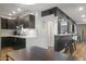 Modern kitchen with dark cabinets, subway tile backsplash, and stainless-steel appliances at 7625 E Camelback Rd # 310B, Scottsdale, AZ 85251