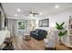 Comfortable living room featuring modern furnishings, hardwood floors and balcony access at 7625 E Camelback Rd # 310B, Scottsdale, AZ 85251