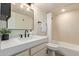 Modern bathroom features a sleek vanity, stylish fixtures, and shower over tub at 7625 E Camelback Rd # A139, Scottsdale, AZ 85251