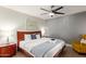 Inviting bedroom with ceiling fan, wood-look floors, and bedside tables at 7625 E Camelback Rd # A139, Scottsdale, AZ 85251