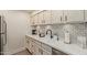 Well-equipped kitchen with stainless steel appliances and white shaker cabinets at 7625 E Camelback Rd # A139, Scottsdale, AZ 85251