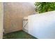 Private patio space with artificial turf and privacy fence, perfect for relaxing at 7625 E Camelback Rd # A139, Scottsdale, AZ 85251