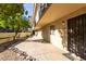 Exterior walkway featuring a secure gated front entrance, beautiful landscape, and neutral color scheme at 7625 E Camelback Rd # A139, Scottsdale, AZ 85251