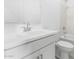 Bright bathroom featuring a white vanity, modern fixtures, and a shower with elegant marble-look tiling at 7638 W Park St, Laveen, AZ 85339