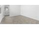 Bedroom featuring plush carpet and view into en-suite bathroom at 7638 W Park St, Laveen, AZ 85339