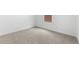Bedroom featuring neutral carpet, window, and white walls at 7638 W Park St, Laveen, AZ 85339