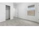 Bedroom with neutral carpet, white walls, and natural light from the window at 7638 W Park St, Laveen, AZ 85339