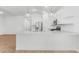 Open concept kitchen boasting white cabinets, stainless steel appliances, and a large center island at 7638 W Park St, Laveen, AZ 85339