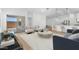 Inviting living room featuring modern furniture, stylish decor, and access to the outdoor space at 7638 W Park St, Laveen, AZ 85339