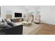 Bright living room with modern furniture, hard wood floors and slider to outside at 7638 W Park St, Laveen, AZ 85339