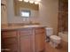 Bathroom with wood vanity, tile floors and access to the shower and tub at 7930 E Broadway Rd, Mesa, AZ 85208