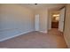 Neutral toned bedroom with tile floors and doorway to a bathroom at 7930 E Broadway Rd, Mesa, AZ 85208