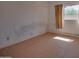 Small bedroom with tile flooring and a window offering natural light at 7930 E Broadway Rd, Mesa, AZ 85208