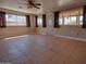Bright and airy living room with tile flooring and multiple windows at 7930 E Broadway Rd, Mesa, AZ 85208