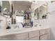 Bathroom vanity with double sinks and bright lighting at 8053 E Dover St, Mesa, AZ 85207
