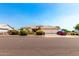 Charming single-Gathering home boasts a three-car garage, well-maintained landscaping, and a welcoming facade at 8053 E Dover St, Mesa, AZ 85207