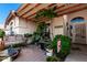 Outdoor space with charming foliage, tile, and patio furniture at 8053 E Dover St, Mesa, AZ 85207