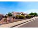 Single-Gathering home with desert landscaping, charming shrubs, iron fence, and desert gravel at 8053 E Dover St, Mesa, AZ 85207