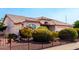 Charming single-Gathering home with desert landscaping and iron fence at 8053 E Dover St, Mesa, AZ 85207