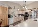 Bright kitchen featuring white cabinets, stainless appliances, and an abundance of counter space at 8053 E Dover St, Mesa, AZ 85207