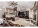Spacious living room with a ceiling fan, plush seating, and bright natural light at 8053 E Dover St, Mesa, AZ 85207