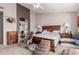 Spacious main bedroom boasting a ceiling fan, carpeted floors, and a decorative accent wall at 8053 E Dover St, Mesa, AZ 85207