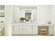 This bathroom features double sinks, vanity space, and modern decor, as well as bright, neutral colors at 8323 E Petunia Ave, Mesa, AZ 85212